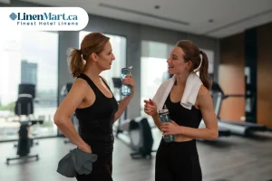 Commercial gym members using premium white, grey, brown, and green gym towels